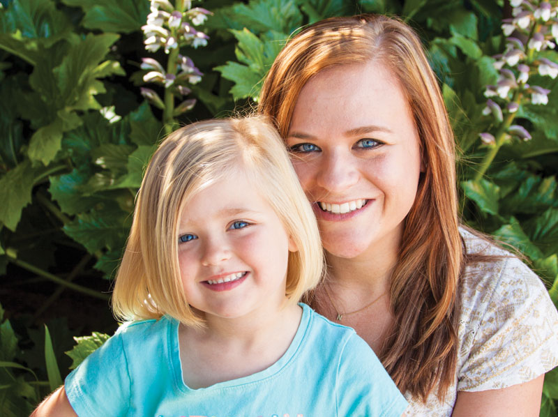 smiling mother and daughter.