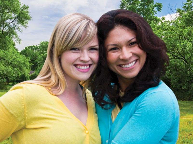 Two ladies smiling.